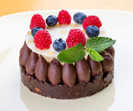 Shortbread chocolate tart with Panna cotta and jam fresh raspberries