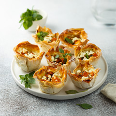 Pumpkin cheese tarts with basil
