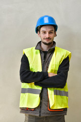 Young apprentice with security helmet, isolated on background