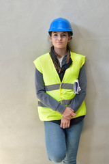 Young apprentice with security helmet, isolated on background