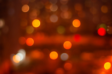 Obraz premium Blurred photo of the night city from the balcony of a residential building. Life in the anthill is addictive.