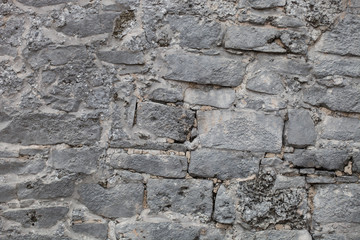 Rough weathered ancient mayan stone  wall surface texture close up