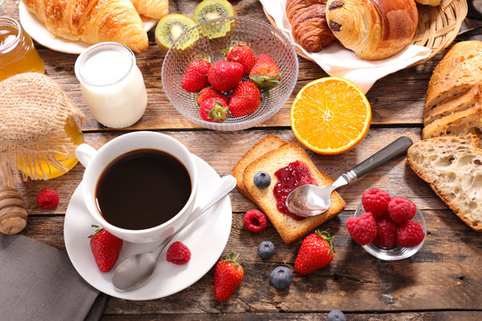 breakfast with coffee cup,bread, croissant and fruit - Powered by Adobe