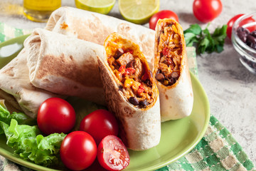 Burritos wraps with mincemeat, beans and vegetables