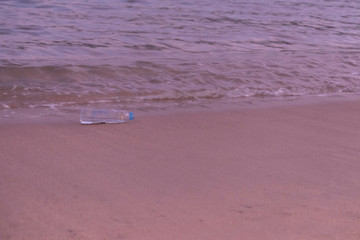 Plastic scraps left over by people on the beach in the evening. Is what causes environmental problems