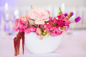 flowers in a vase on light background