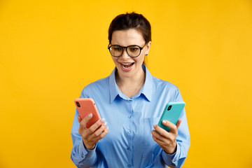 conversion funnel, A B test in marketing and online advertising. Brunette woman holding colored letters A and B in hands with face expression.