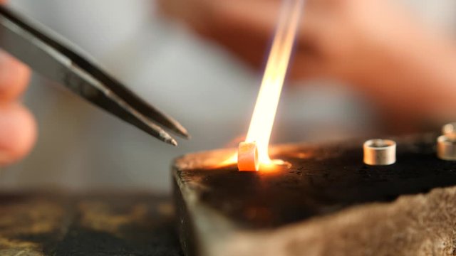 Close Up Of Man Making Traditional Burmese Silver Jewerly With Gas Burner. Silversmiths Floating Workshops. 4K Footage.