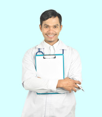 doctor with stethoscope holding a clipboard on blue background.