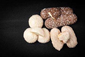Different types of cookies on black background.