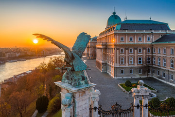 Fototapeta na wymiar Budapest, Hungary - Aerial view of Buda Castle Royal Palace at autumn sunrise. Elisabeth Bridge, River Danube at background with clear blue and golden sky