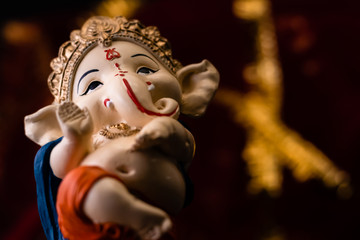 low angle body shot of ganesha statue blessing with the hand. hinduism and religious concept.