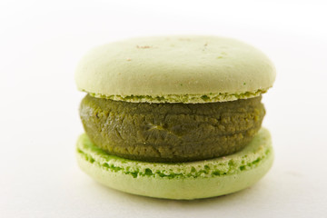 Matcha green tea macaroon on white background 