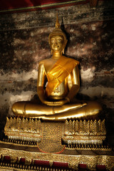 Bangkok Thailand Wat Suthat Thepwararam - meditating golden buddha statue at sunset