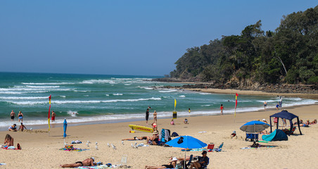 beach with umbrellas and sunbeds