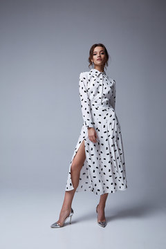 Pretty beautiful sexy elegance woman skin tan body fashion model glamor pose wear trend dress casual clothes party spring collection makeup hair style brunette success accessory jewelry studio.