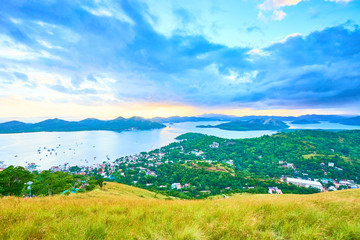Fototapeta na wymiar View from Mount Tapyas on Coron Island - North Palawan, Philippines. Looking over Coron Town and Bay at Sunset.