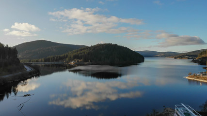 lake in winter surrounded forest