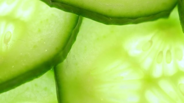 Top view of fresh sliced cucumber rotation
