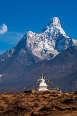 Buddhist stupa on the background of the Himalayan mountains. Nepal. Himalayas. Panorama of the Himalayan mountains. Trekking in the Himalayas.