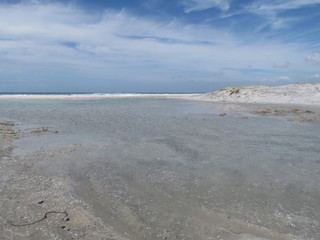Summer morning at the beach with high tide.