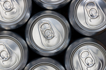 Silver soda metal diet energy drinks cans top view background