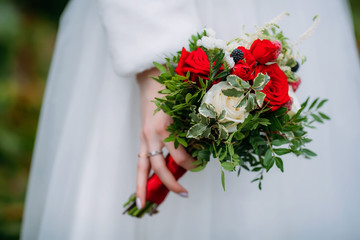 Bridal bouquet in white and red colors