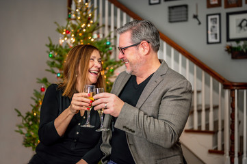 cute couple celebrating new years eve with champagne toast