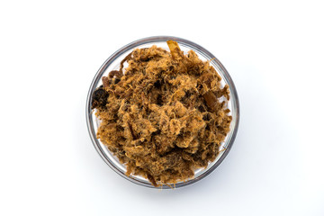 Top View of Domestic salty fried Pork greaves, duvan cvarci, in a Glass Bowl on a white background