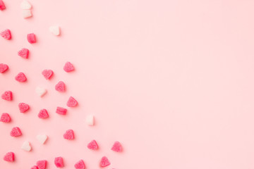 Composition for Valentine's Day. Pink hearts on pastel pink background. Valentine day concept, design. Flat lay, top view, copy space, banner