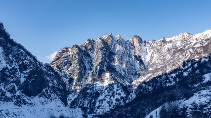Fototapeta na wymiar Snow covered mountain range landscape