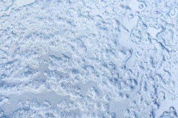 Texture macro photo of ice. Empty light background .