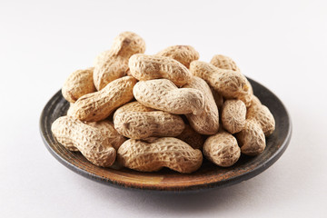 Heap of peanuts on white background
