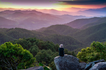 hiker on the top of mountain