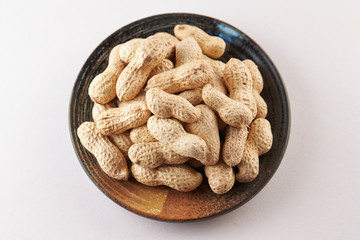 Heap of peanuts on white background