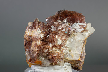 Macro minerals Axinite stone on a gray background