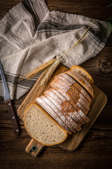Sliced loaf of bread on a chopping board.