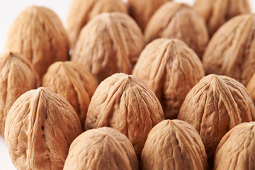 Heap of walnuts on white background