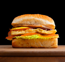 burger cheeseburger hamburger side view on dark background on blackboard