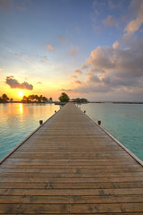 Fototapeta na wymiar Footbridge of Paradise Island (Lankanfinolhu) at sunset, Maldives
