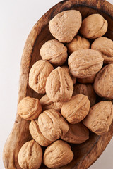 Heap of walnuts on white background