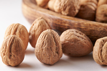 Heap of walnuts on white background