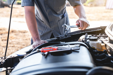 Technician hands of car mechanic in doing auto repair service and maintenance worker repairing vehicle with wrench, Service and Maintenance car check