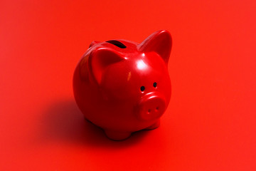 Red piggy Bank on a red background