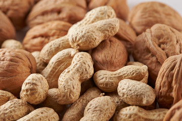Heap of walnuts and peanuts background