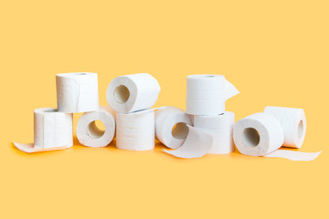 Lots of toilet paper rolls in a groupм