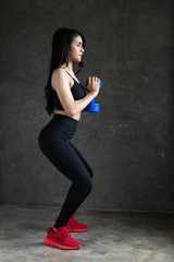 Beauitful asian woman stay in room,practive yoga and training exercise on gray floor.