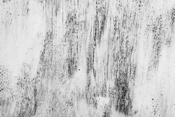 Texture of a concrete wall with cracks and scratches which can be used as a background