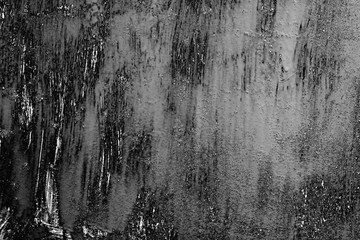 Texture of a concrete wall with cracks and scratches which can be used as a background