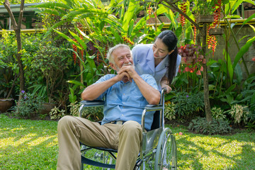 Young nurse take care senior man at home, Senior man happniess and smiling with nurse, Health care concept